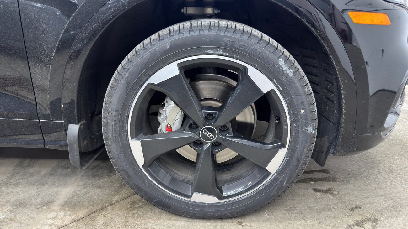 Wheel covered in brake dust and salt film