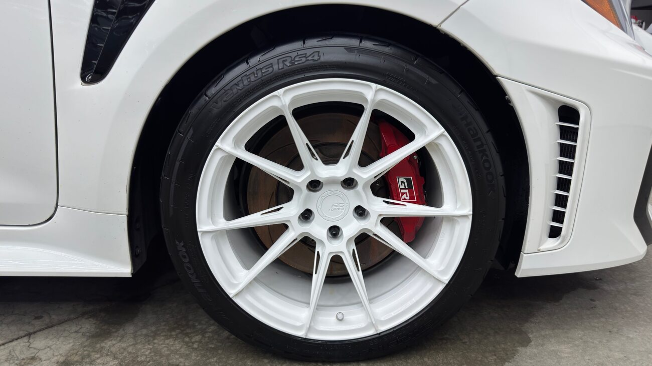 White forged wheel with red caliper