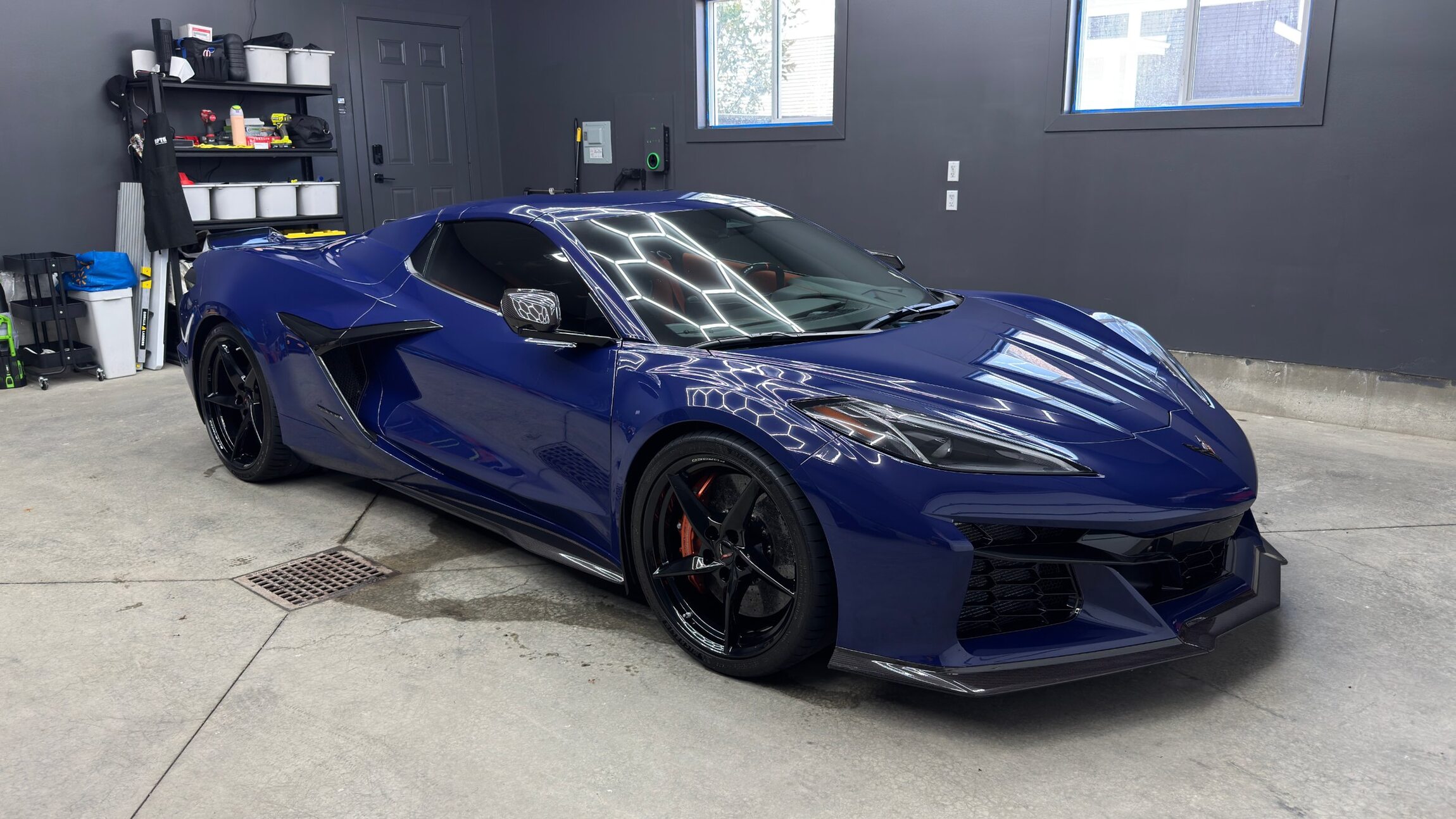 A Corvette Z06 finished under the studio hex lighting